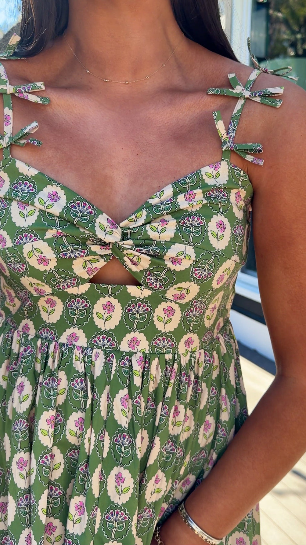 green floral sweetheart neckline midi dress with bow straps and chest cutout