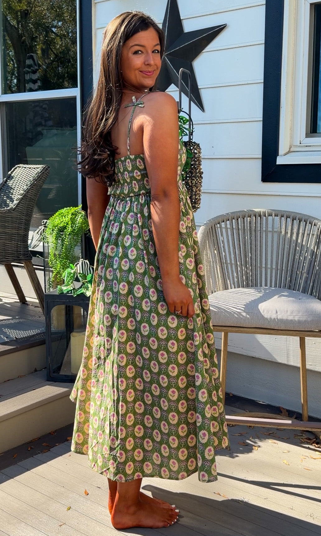 green floral sweetheart neckline midi dress with bow straps and chest cutout