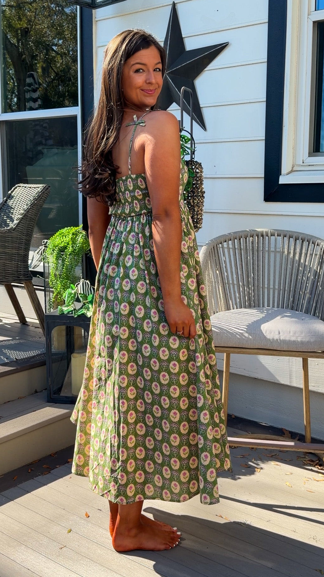 green floral sweetheart neckline midi dress with bow straps and chest cutout