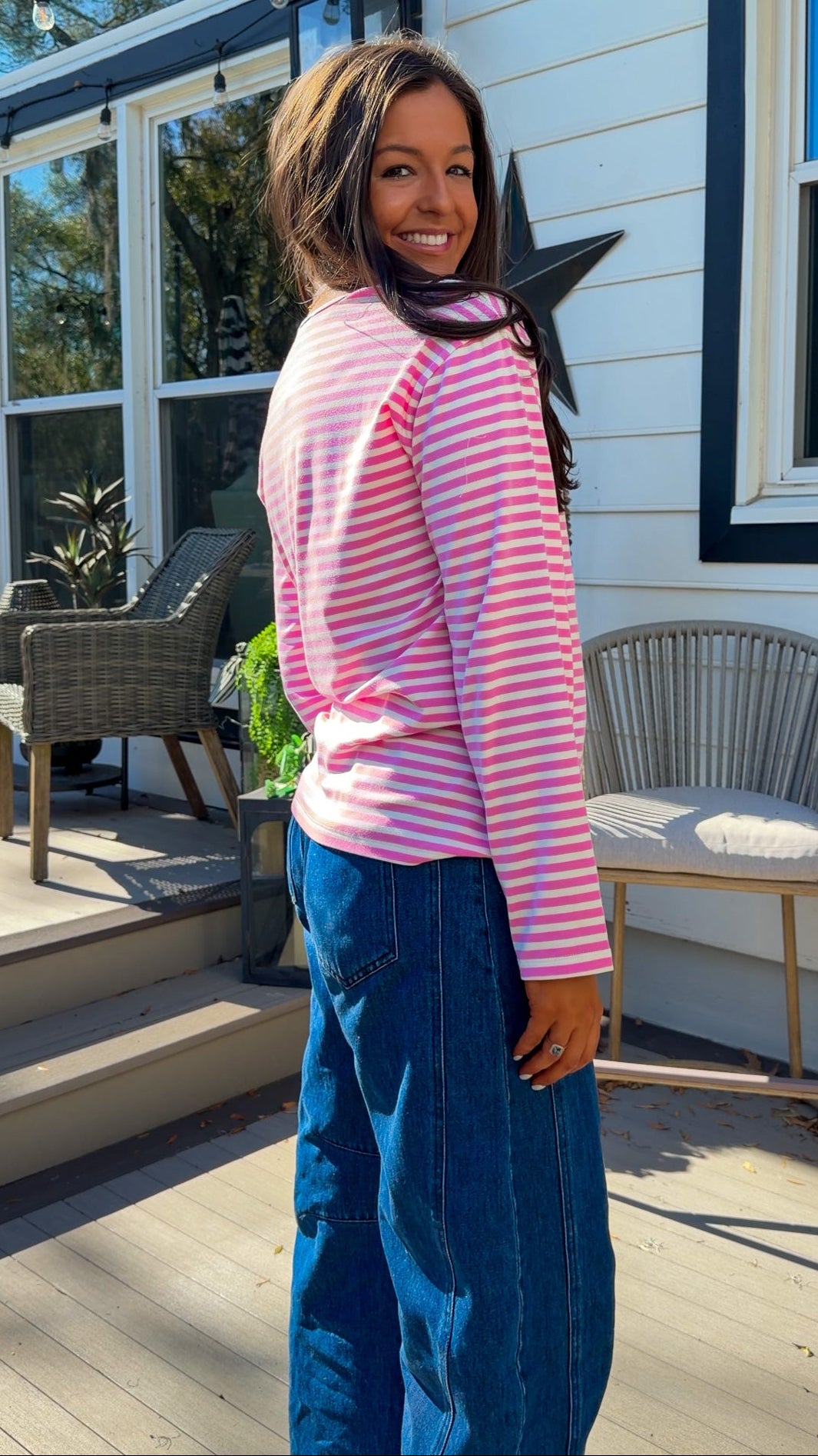 pink and white striped long sleeve knit top with relaxed fit