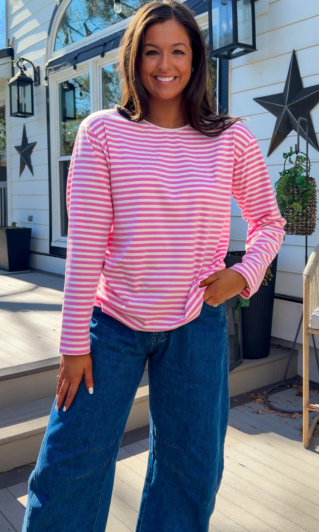 pink and white striped long sleeve knit top with relaxed fit