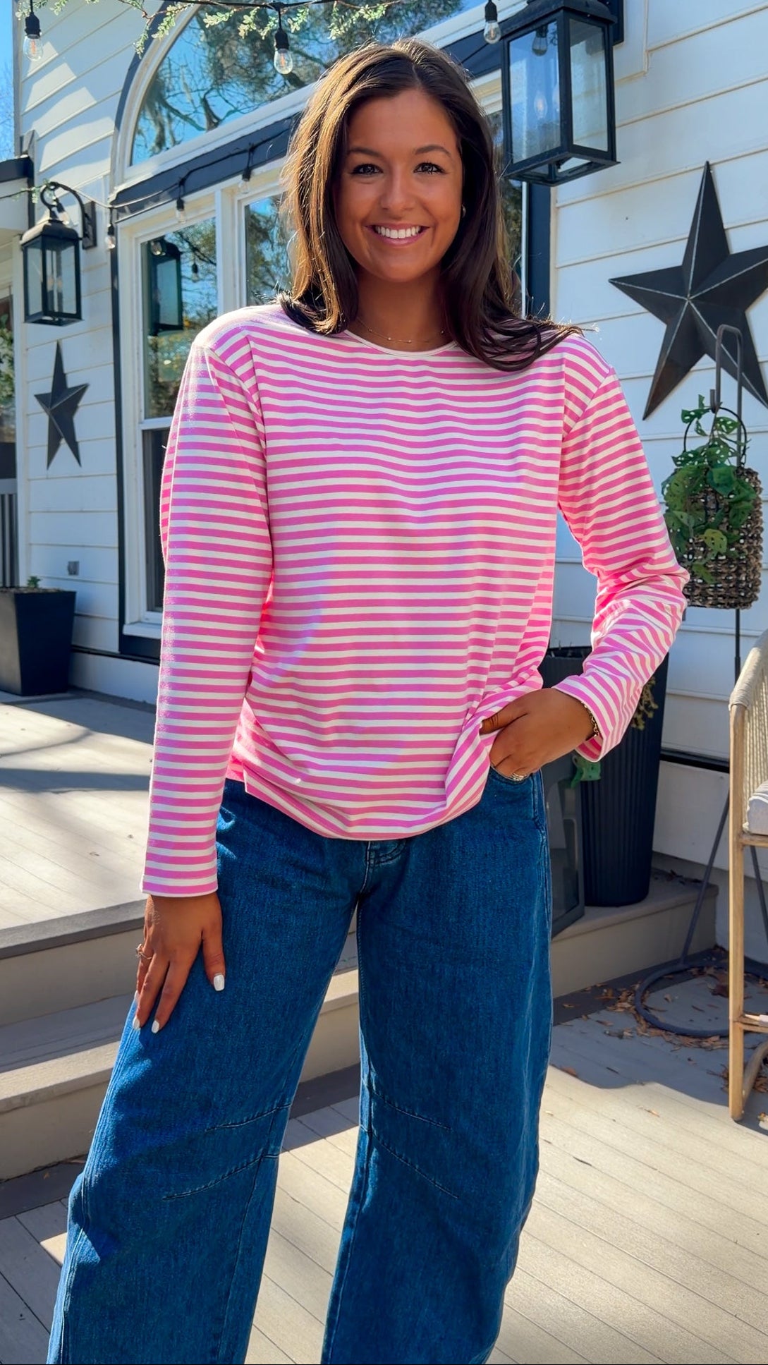 pink and white striped long sleeve knit top with relaxed fit