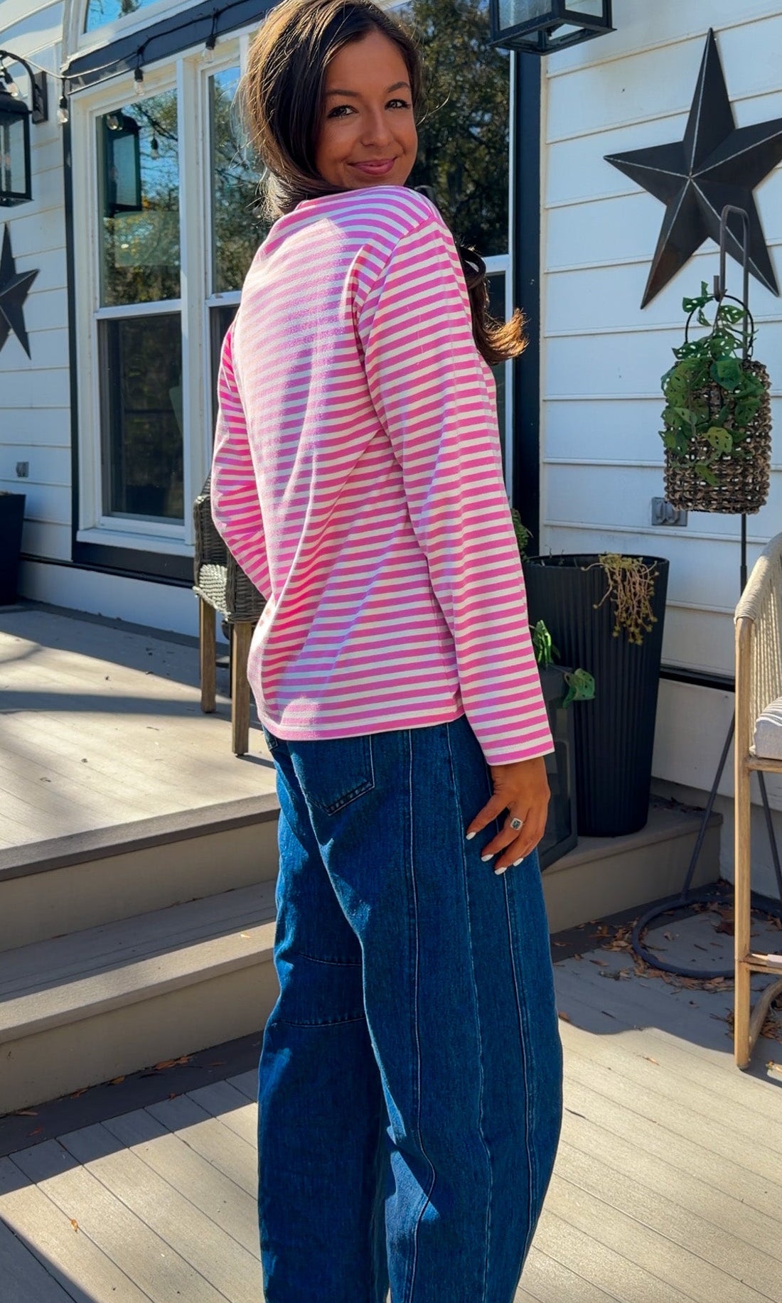 pink and white striped long sleeve knit top with relaxed fit