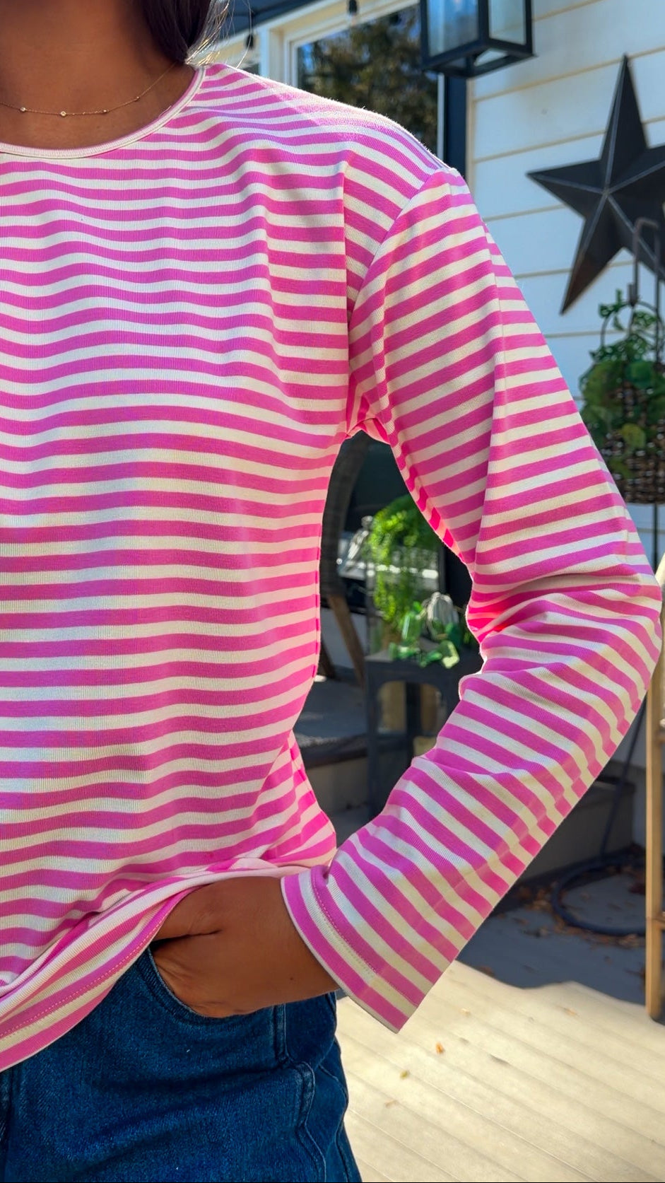 pink and white striped long sleeve knit top with relaxed fit