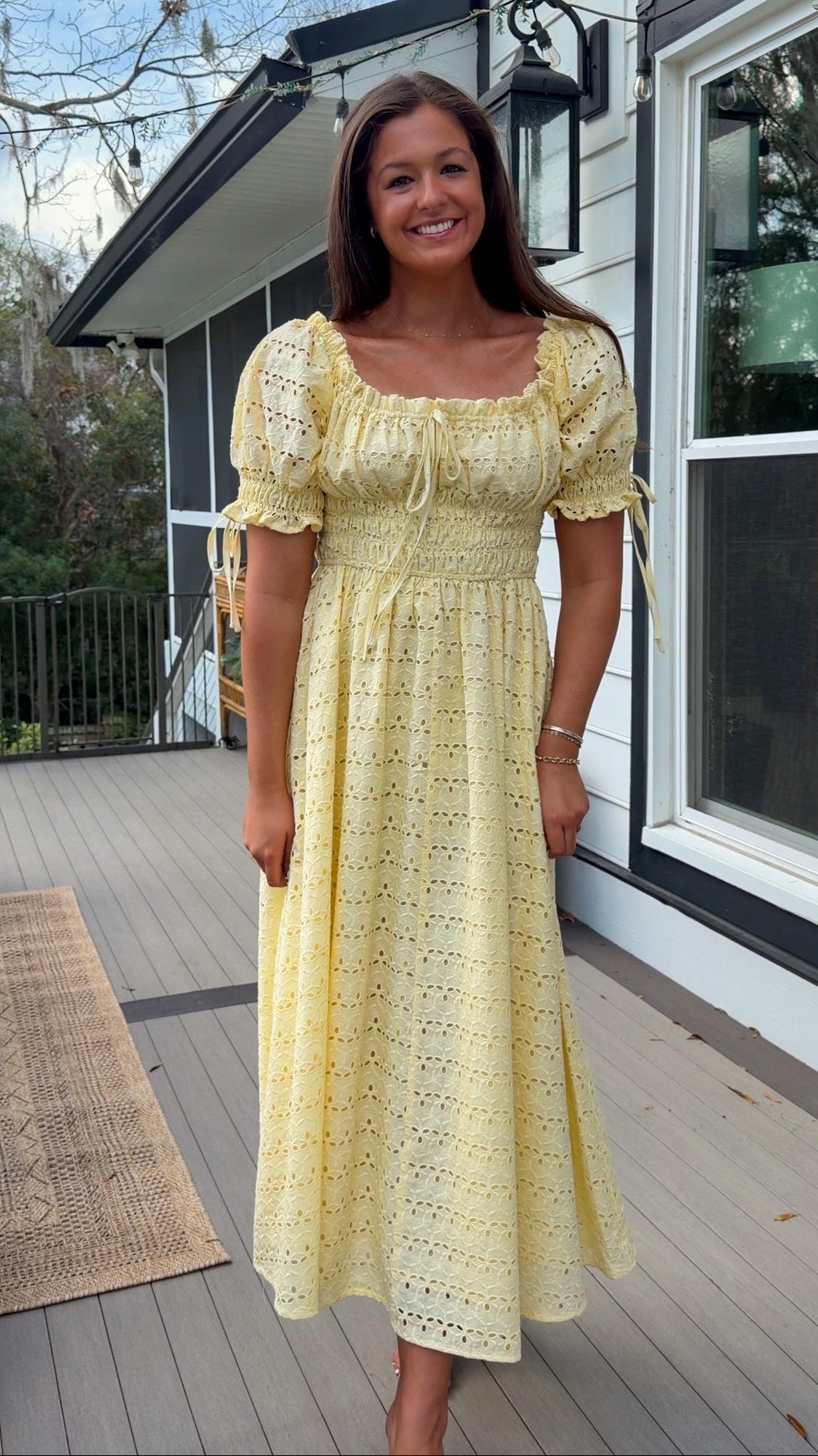 Yellow eyelet lace maxi dress with smocked bodice and puff sleeves