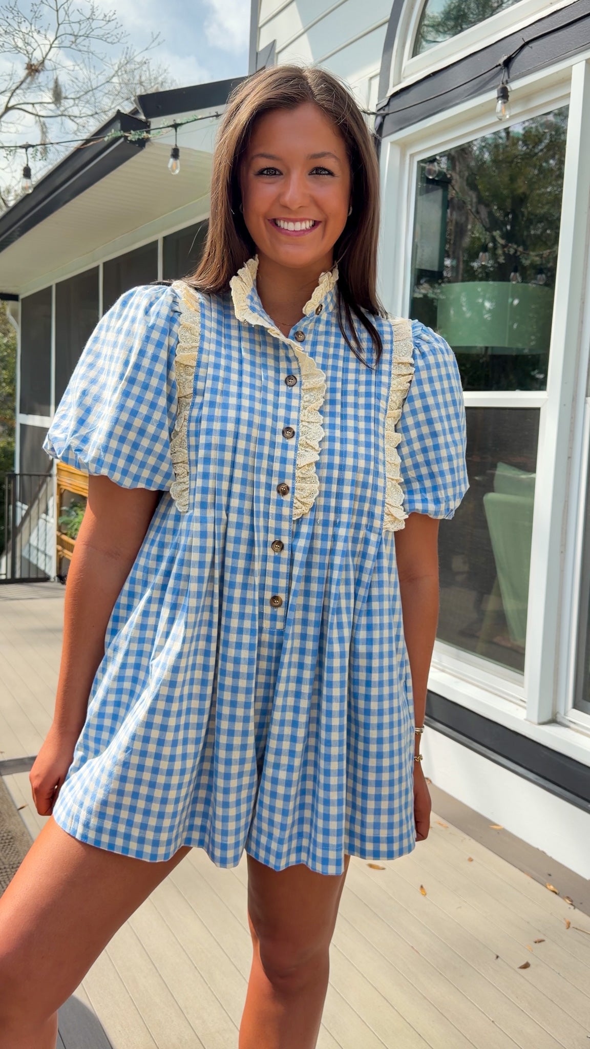 Blue gingham puff sleeve romper with lace trim and ruffle collar