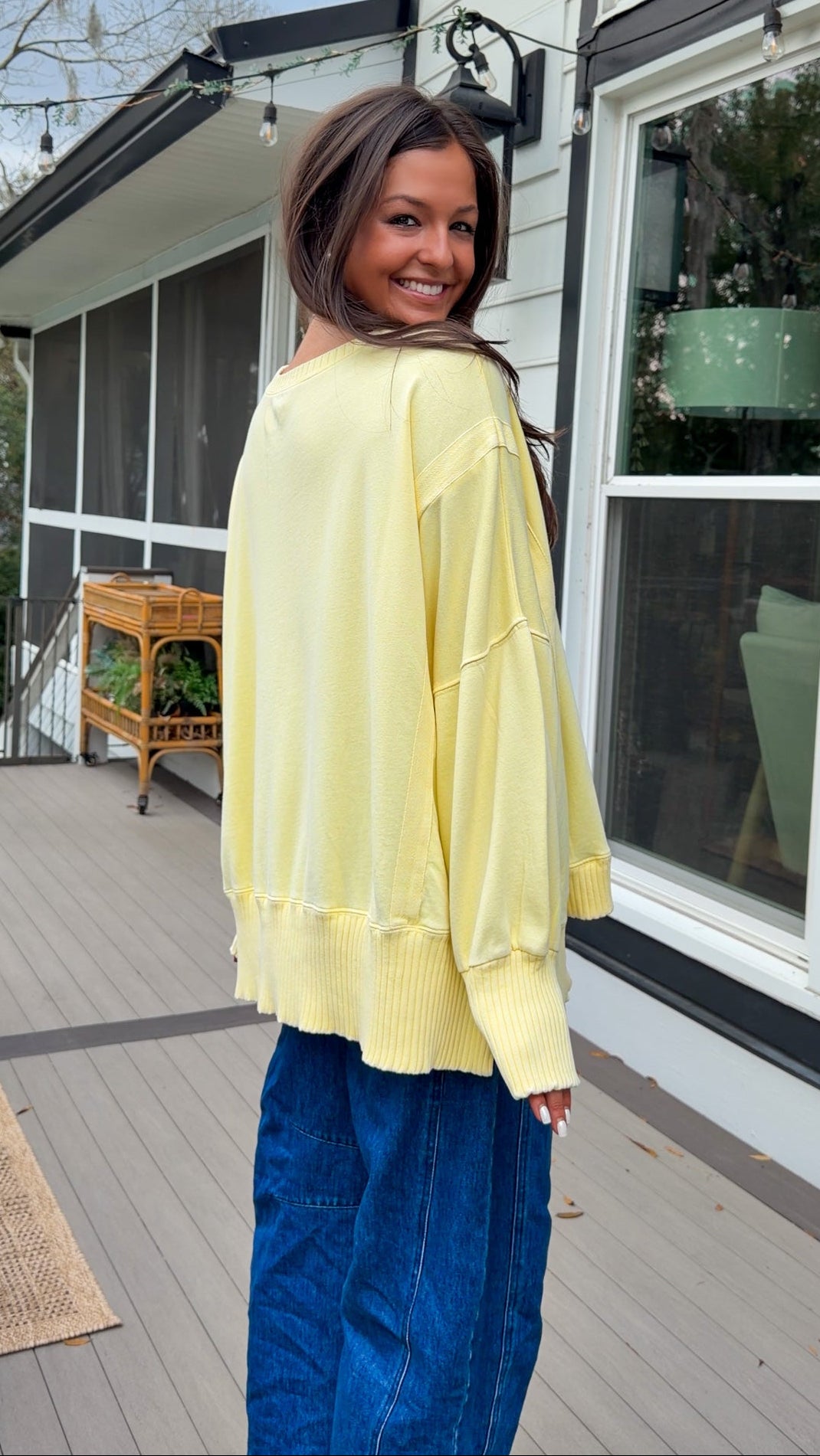mineral washed oversized yellow pullover with ribbed trim and relaxed fit. vintage soft fleece oversized sweatshirt in pastel yellow casual everyday style