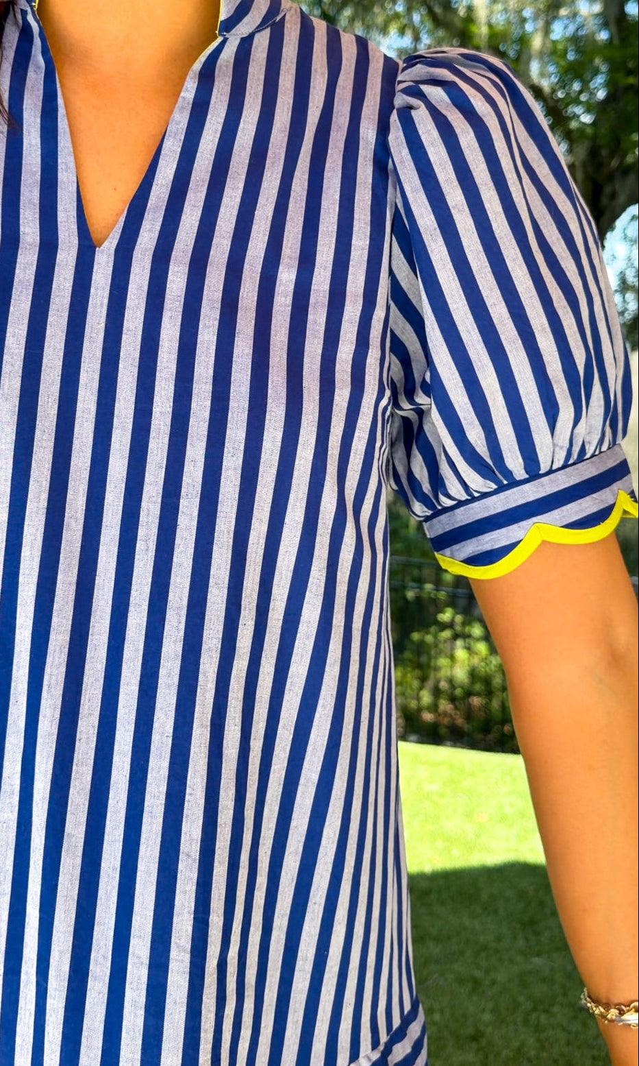 blue striped mini collared dress with puff sleeves and lime scallop trim