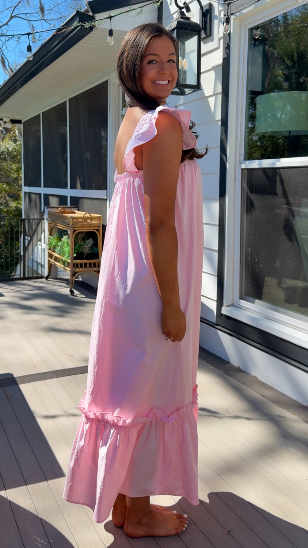 baby pink midi dress with flutter sleeves and tiered ruffle hem