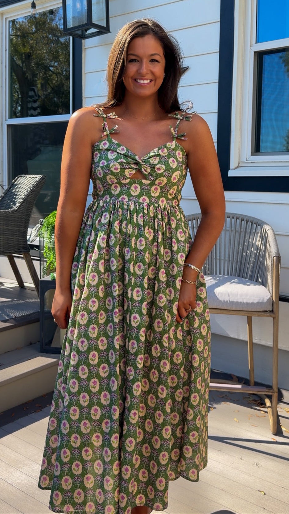 green floral sweetheart neckline midi dress with bow straps and chest cutout