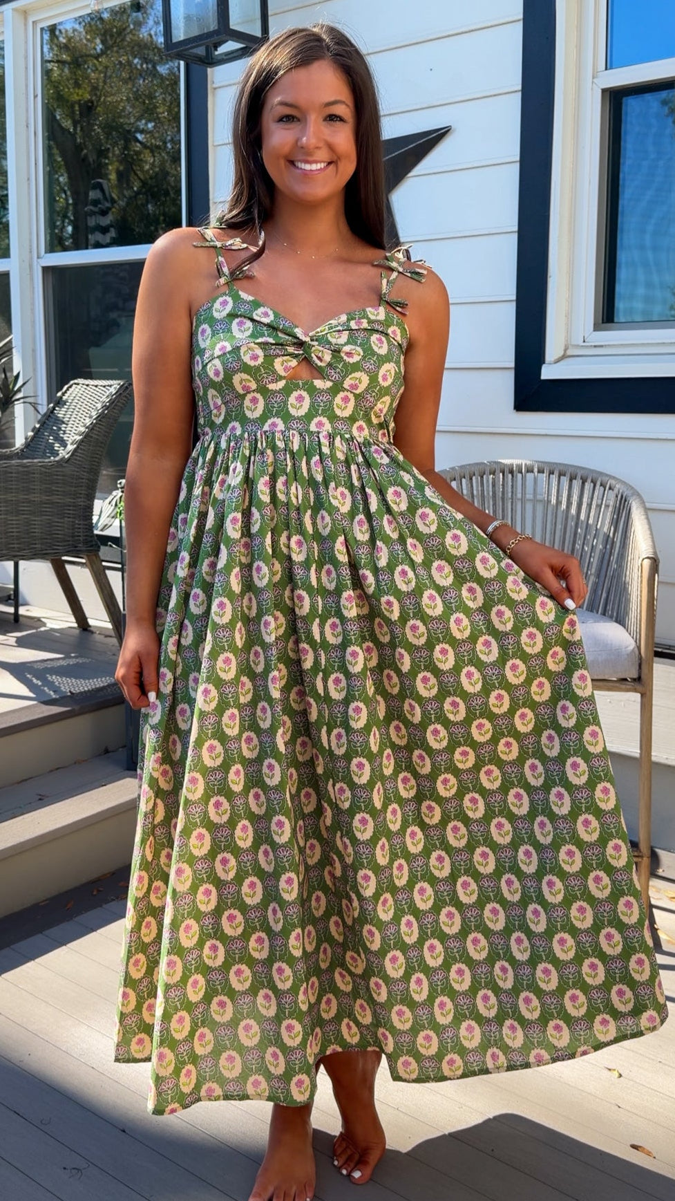 green floral sweetheart neckline midi dress with bow straps and chest cutout