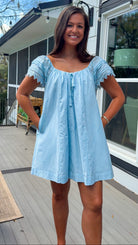 light blue linen blend mini dress with eyelet lace trim sleeves and tie neckline