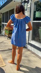 blue stripe babydoll mini dress with gathered neckline short sleeves and side pockets