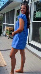 blue stripe babydoll mini dress with gathered neckline short sleeves and side pockets