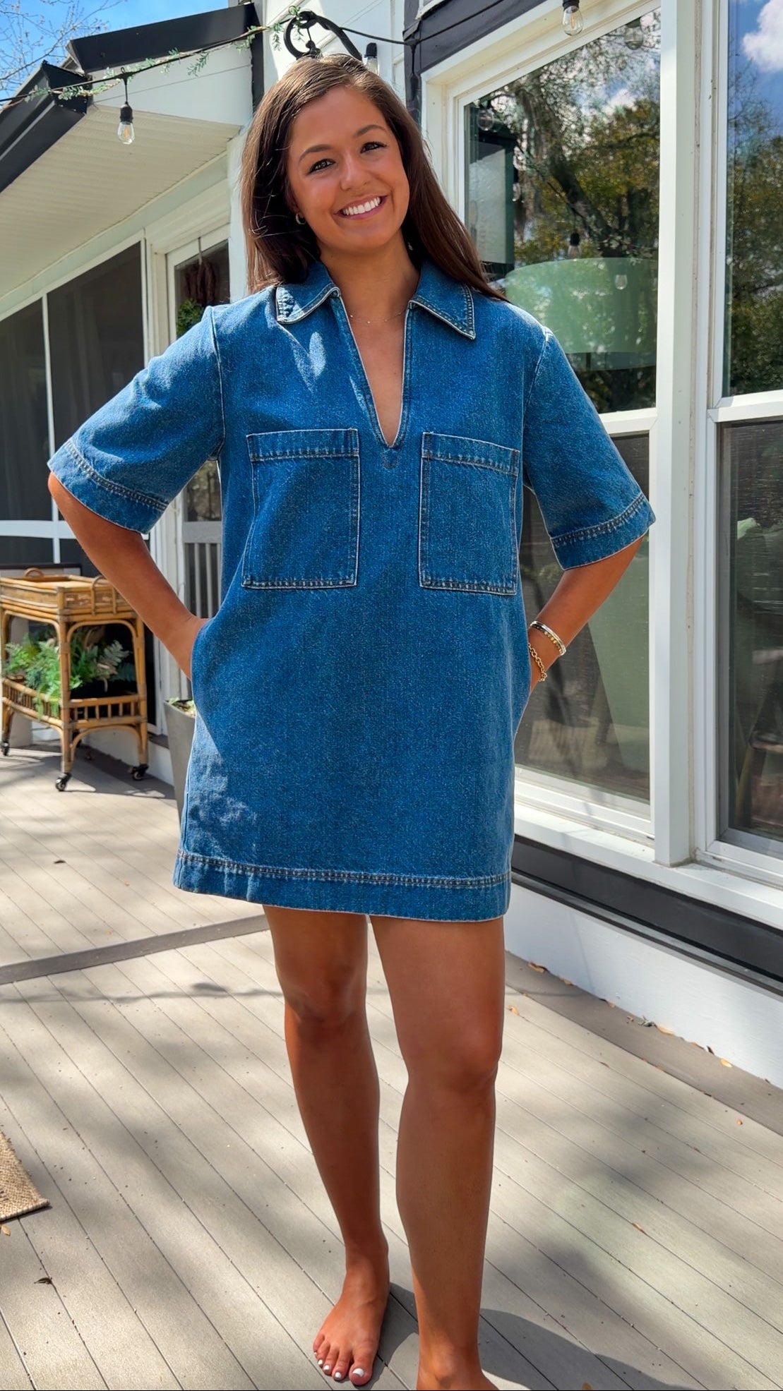 oversized denim mini dress with collar v neckline half sleeves and front patch pockets