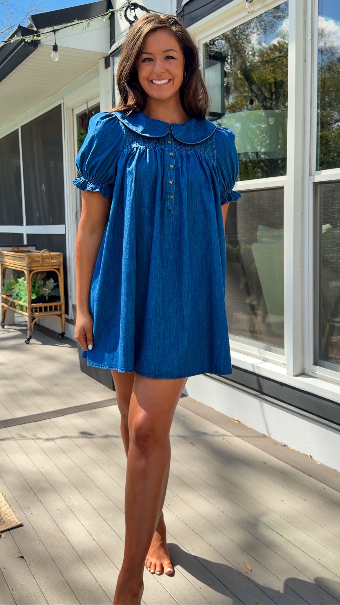 denim mini dress with peter pan collar puff sleeves button front and smocked back detail