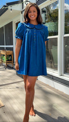 denim mini dress with peter pan collar puff sleeves button front and smocked back detail
