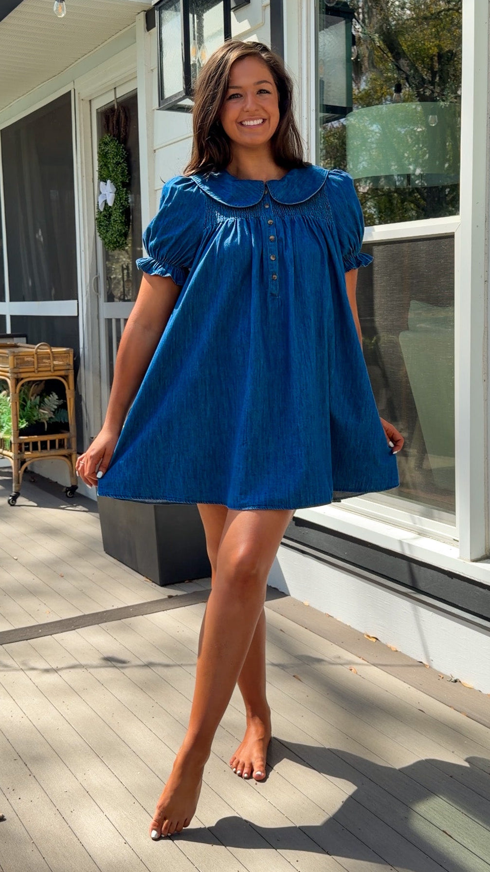 denim mini dress with peter pan collar puff sleeves button front and smocked back detail