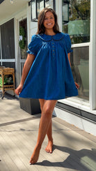 denim mini dress with peter pan collar puff sleeves button front and smocked back detail