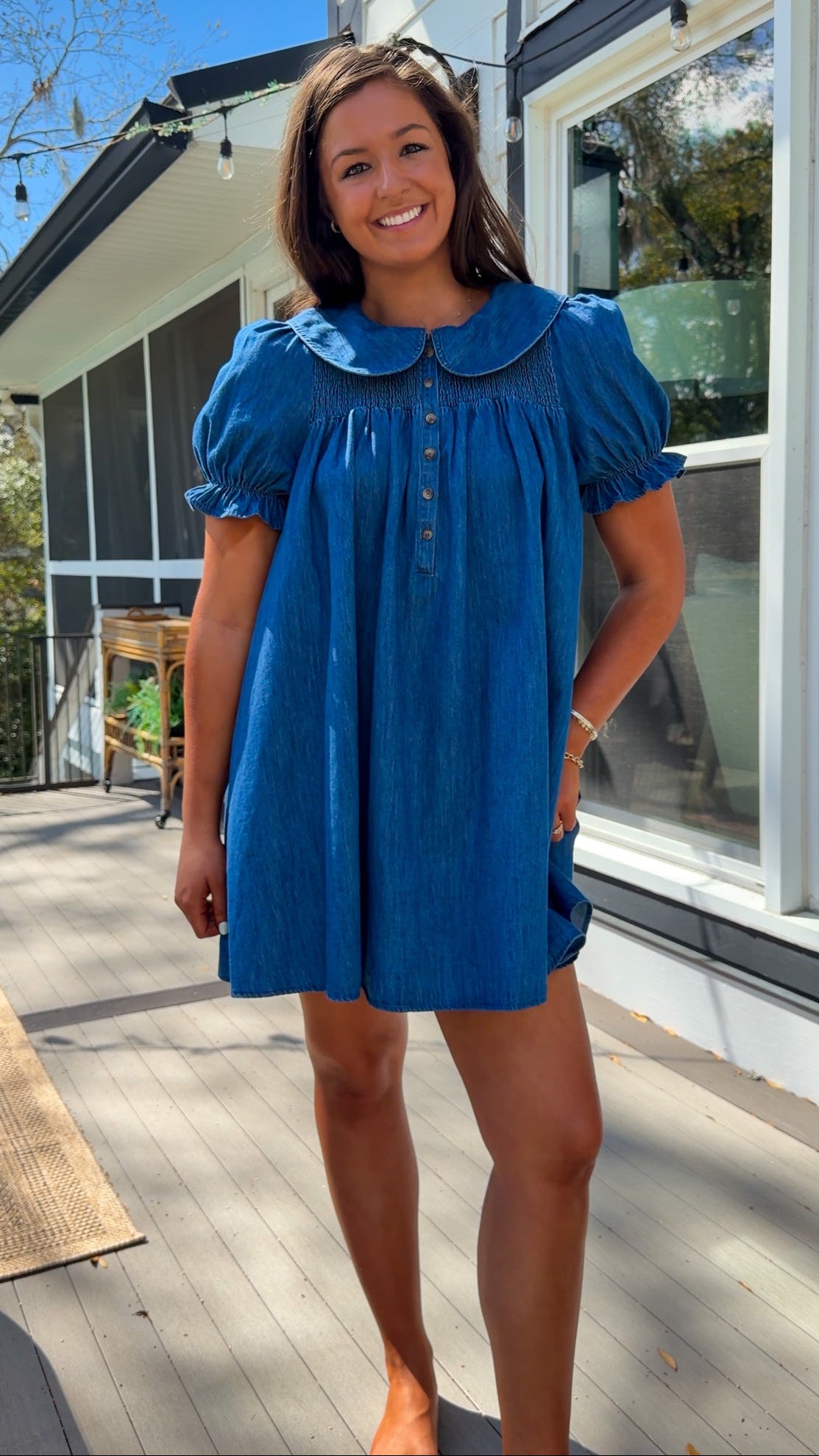 denim mini dress with peter pan collar puff sleeves button front and smocked back detail