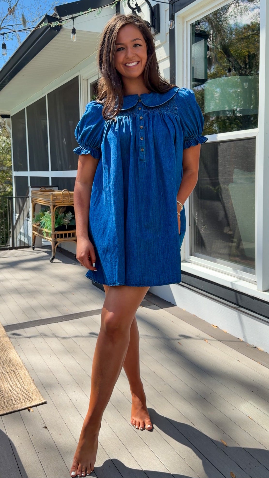 denim mini dress with peter pan collar puff sleeves button front and smocked back detail