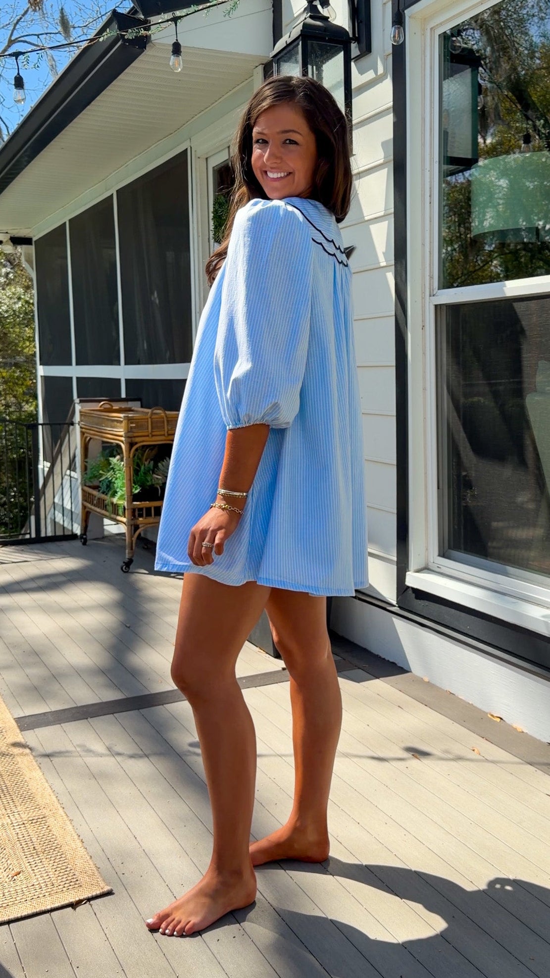 light blue striped mini dress with scalloped collar contrast trim bow tie and button front