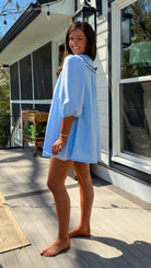 light blue striped mini dress with scalloped collar contrast trim bow tie and button front