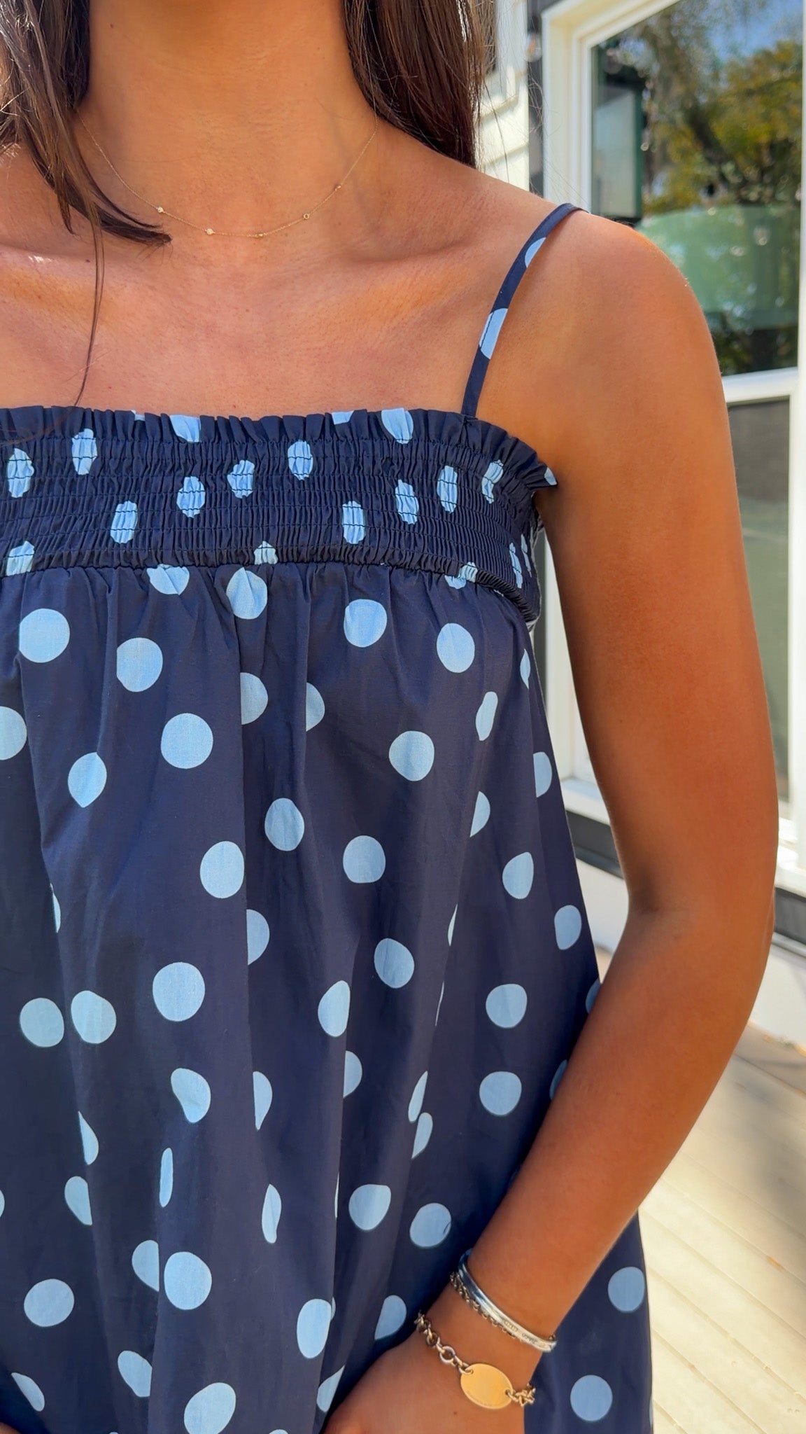midnight blue polka dot maxi dress with smocked bodice and adjustable spaghetti straps