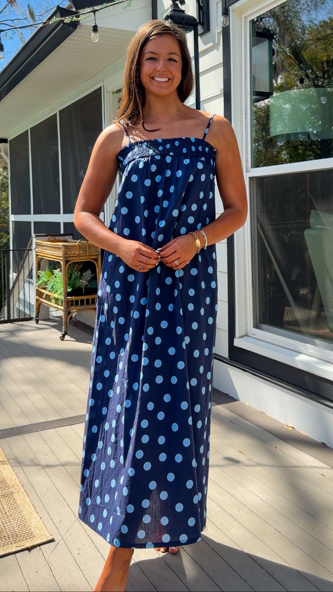 midnight blue polka dot maxi dress with smocked bodice and adjustable spaghetti straps