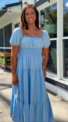 baby blue puff sleeve midi dress with square neckline smocked waist and tiered skirt