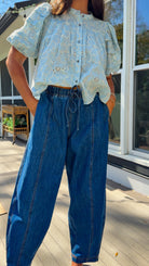 wide leg barrel denim pants with elastic drawstring waistband and front seam detail in medium wash