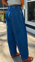 wide leg barrel denim pants with elastic drawstring waistband and front seam detail in medium wash