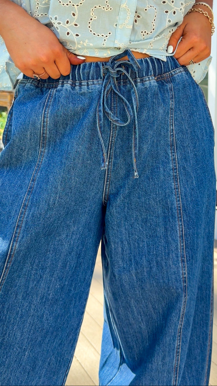 wide leg barrel denim pants with elastic drawstring waistband and front seam detail in medium wash