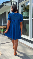 denim mini dress with peter pan collar puff sleeves button front and smocked back detail