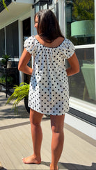 white and black polka dot mini dress with black bow