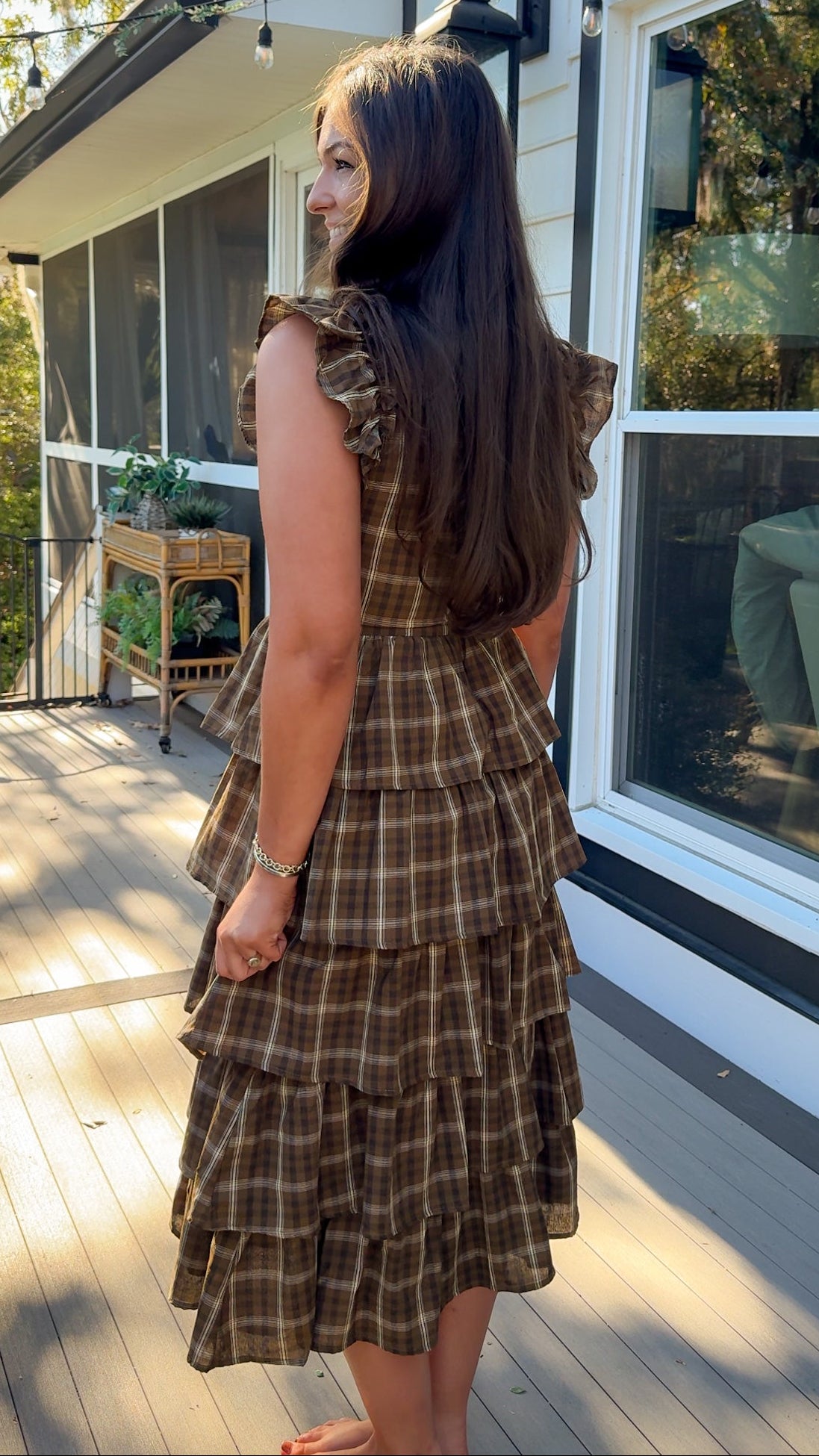 brown plaid ruffle midi dress with flutter sleeves and ruffle collar side back view