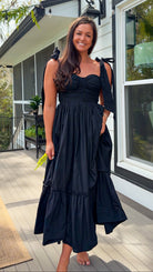 black midi dress with ruched bust tie straps smocked back and tiered skirt