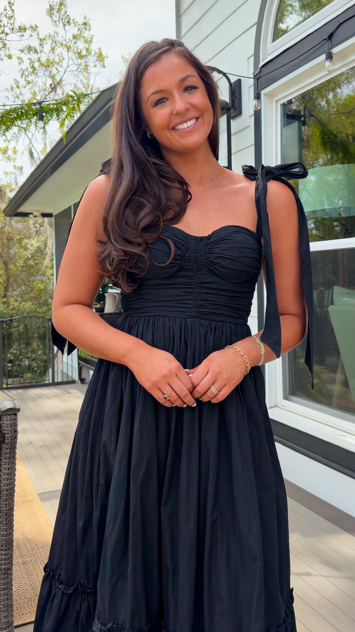 black midi dress with ruched bust tie straps smocked back and tiered skirt