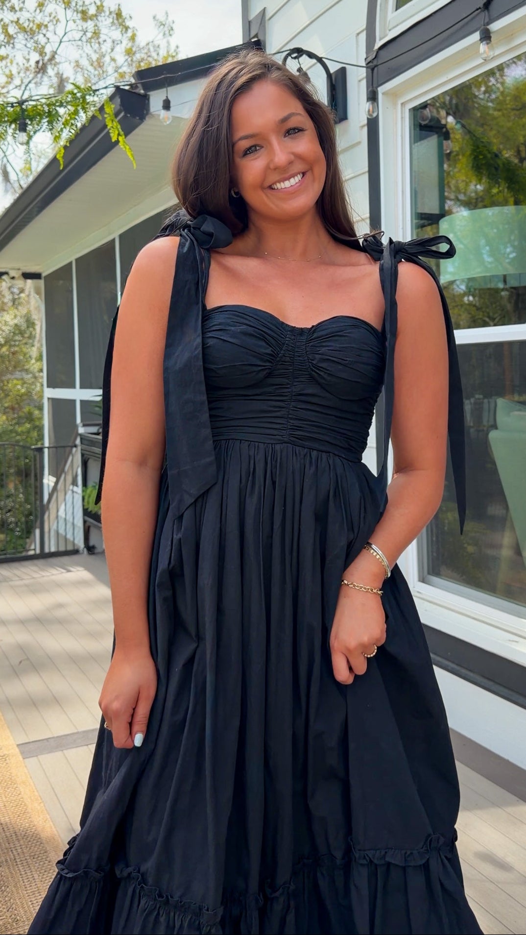 black midi dress with ruched bust tie straps smocked back and tiered skirt