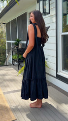 black midi dress with ruched bust tie straps smocked back and tiered skirt