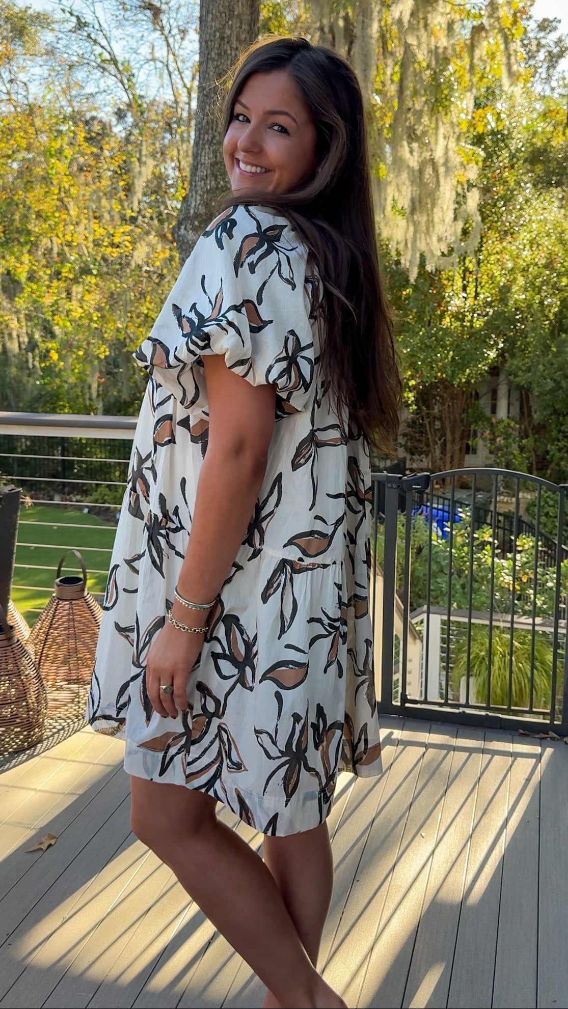 floral dress collared cream white and brown floral design button down closure and puff sleeves side view