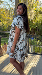 floral dress collared cream white and brown floral design button down closure and puff sleeves side view