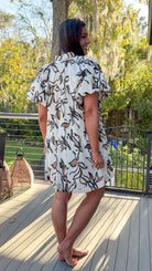 floral dress collared cream white and brown floral design button down closure and puff sleeves side back view