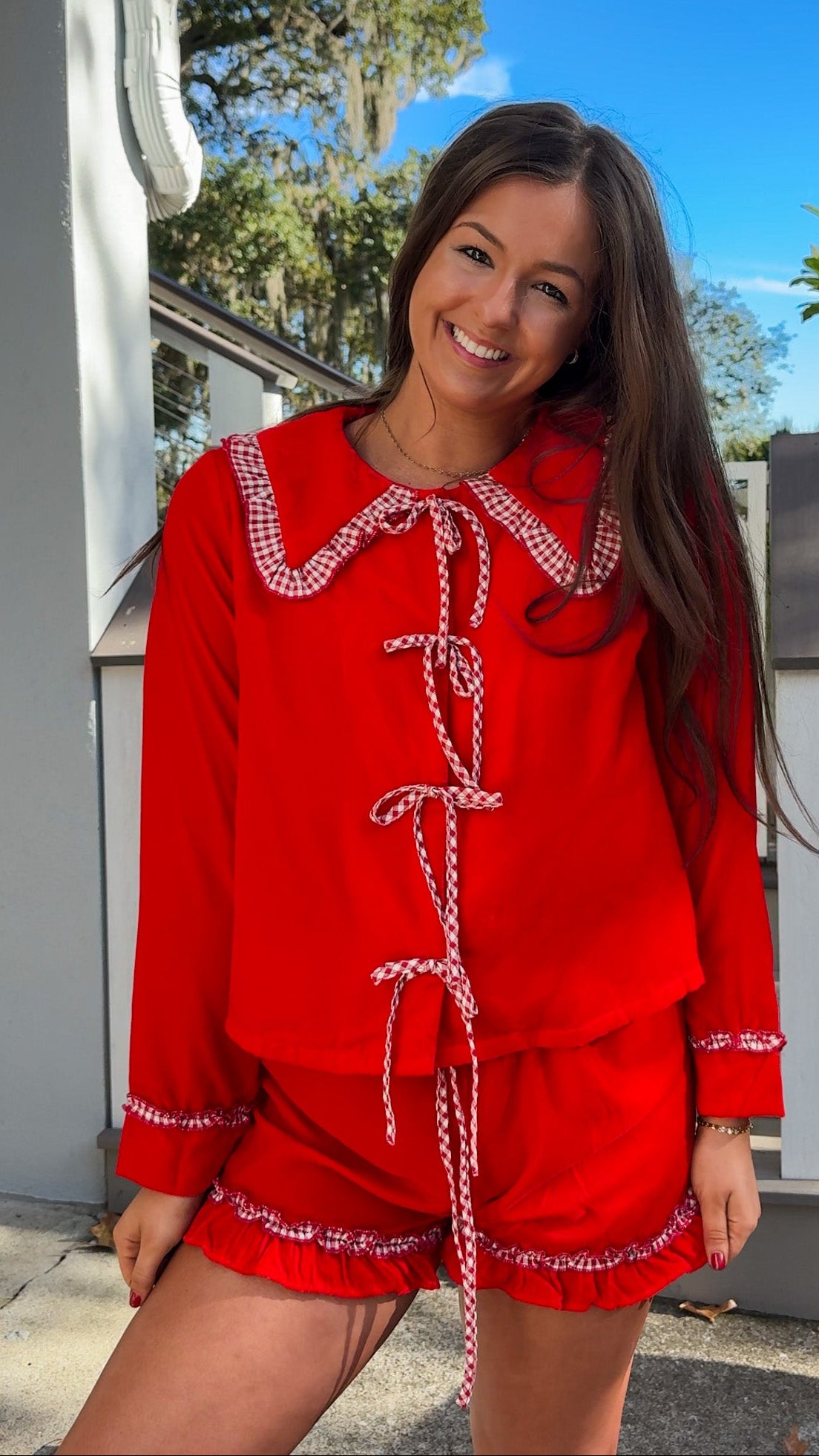 red velvet long sleeve top and short pajama set with gingham oversized peter pan collar and ruffle trim on shorts christmas pajamas bows 
