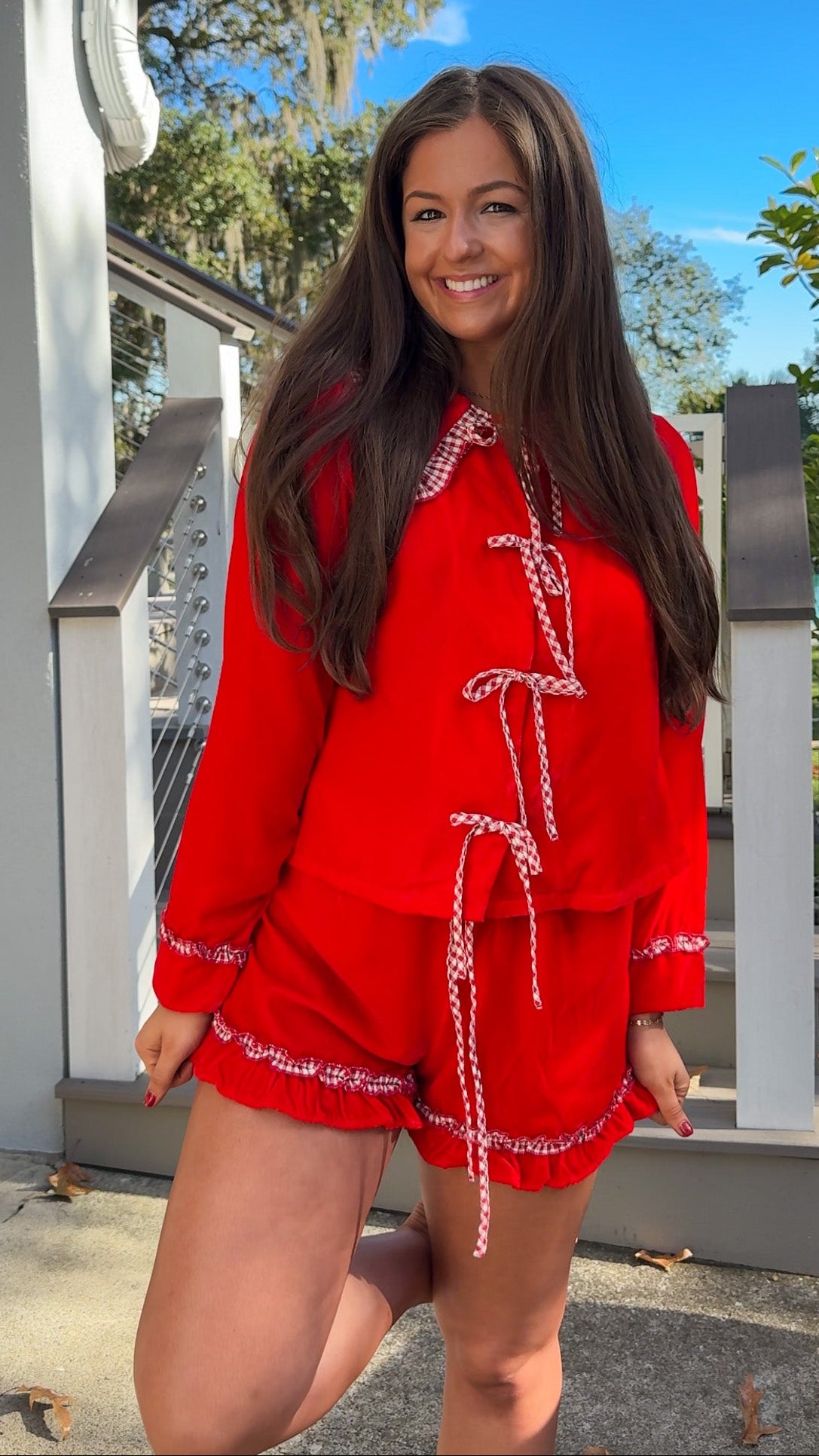 red velvet long sleeve top and short pajama set with gingham oversized peter pan collar and ruffle trim on shorts christmas pajamas bows 3 close