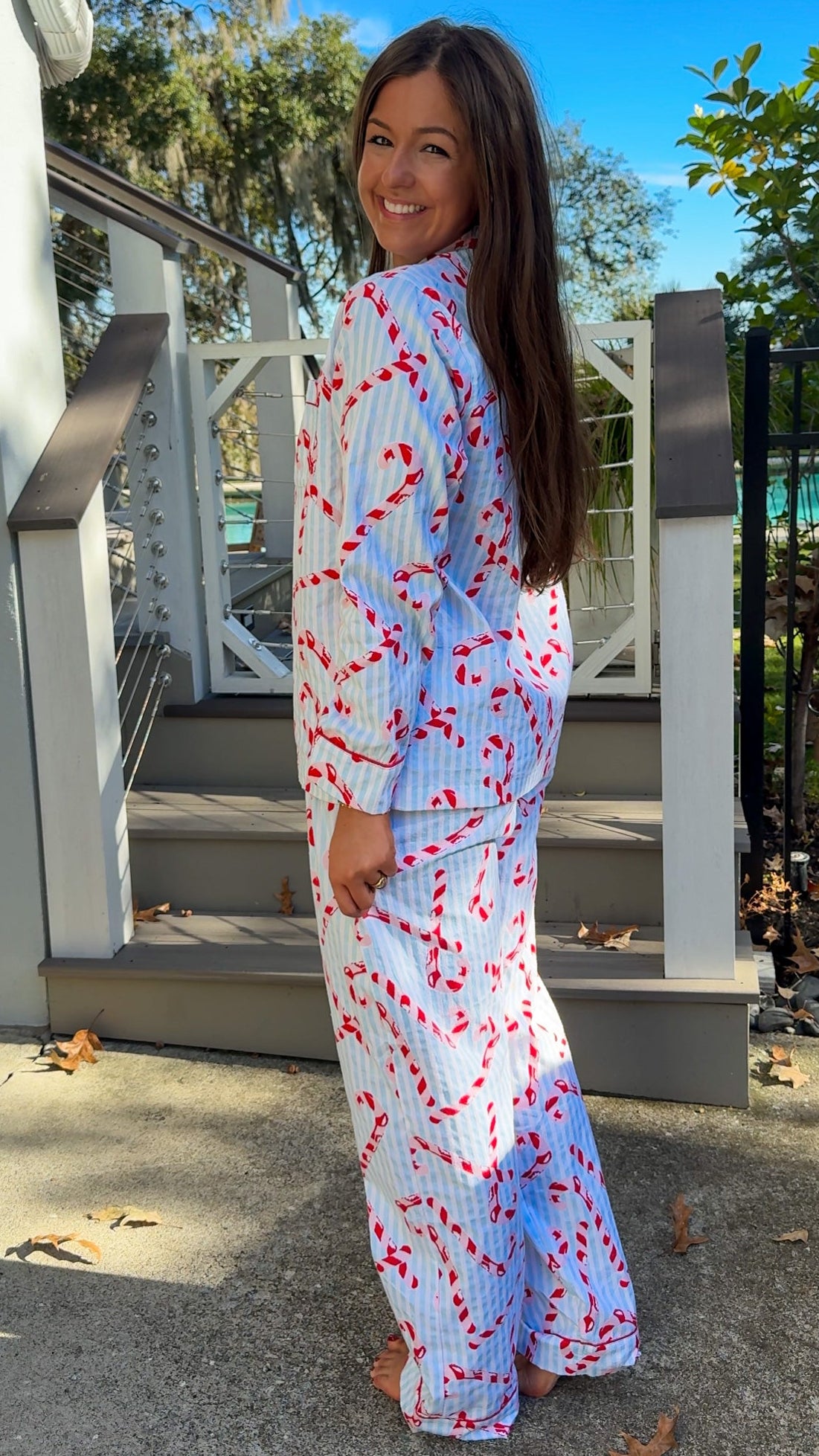 blue and white stripe pajama long pant and long sleeve shirt set with candy canes and button down closure soft loungewear side2