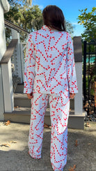 blue and white stripe pajama long pant and long sleeve shirt set with candy canes and button down closure soft loungewear back