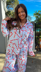 blue and white stripe pajama long pant and long sleeve shirt set with candy canes and button down closure soft loungewear close