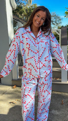 blue and white stripe pajama long pant and long sleeve shirt set with candy canes and button down closure soft loungewear fun