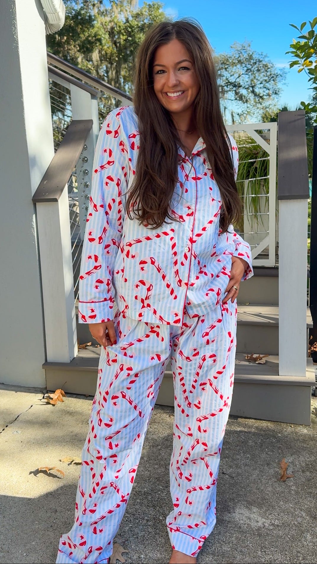 blue and white stripe pajama long pant and long sleeve shirt set with candy canes and button down closure soft loungewear